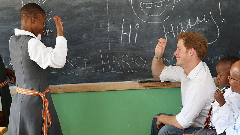 Illustration for article titled Your Boyfriend Prince Harry Grins His Way Through a Visit to Lesotho